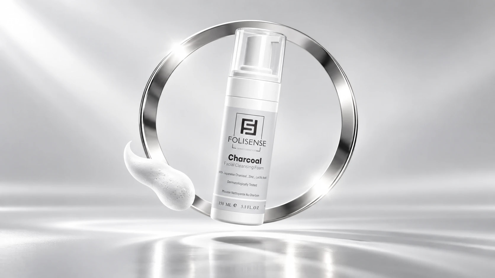 Folisense charcoal foam within a silver orbit